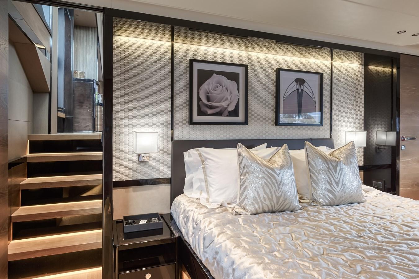a bed with a white sheet aboard AQUARIUS Yacht for Sale