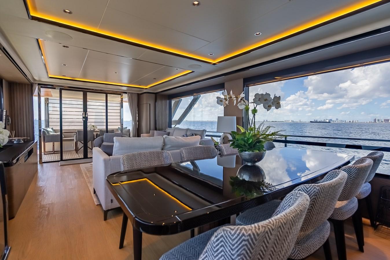 a living room with a large window aboard AQUARIUS Yacht for Sale