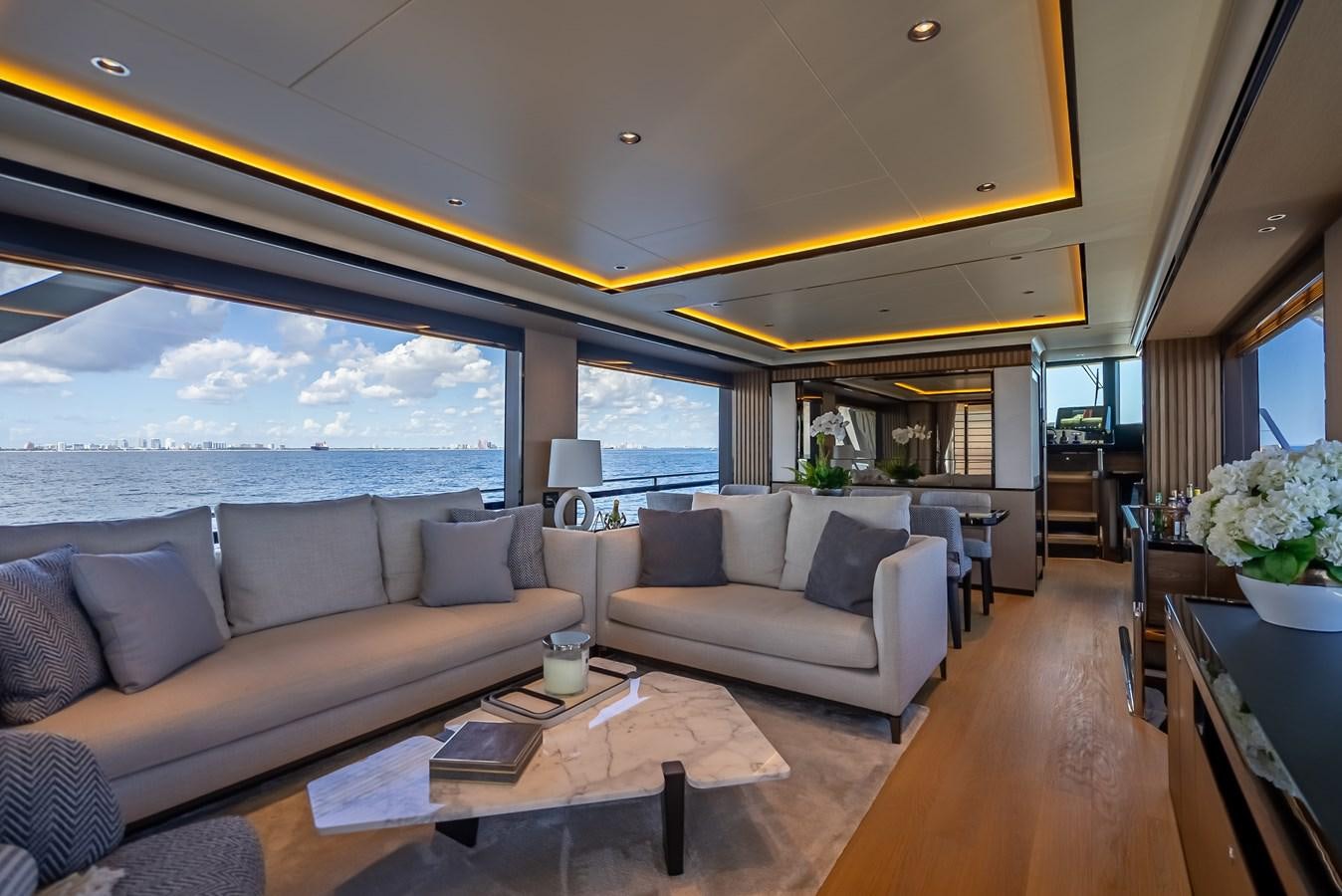 a living room with a large window aboard AQUARIUS Yacht for Sale