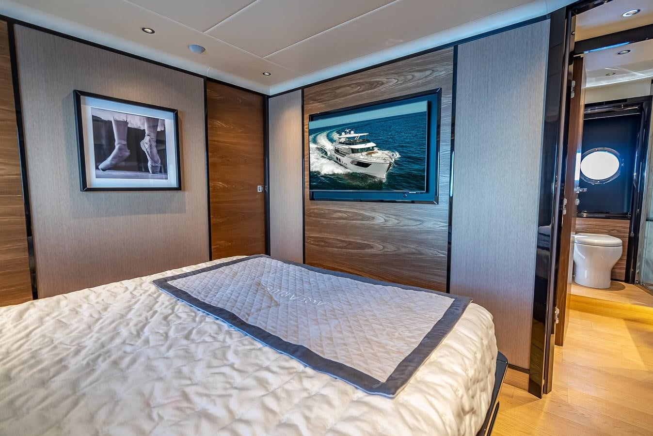 a bed in a room aboard AQUARIUS Yacht for Sale