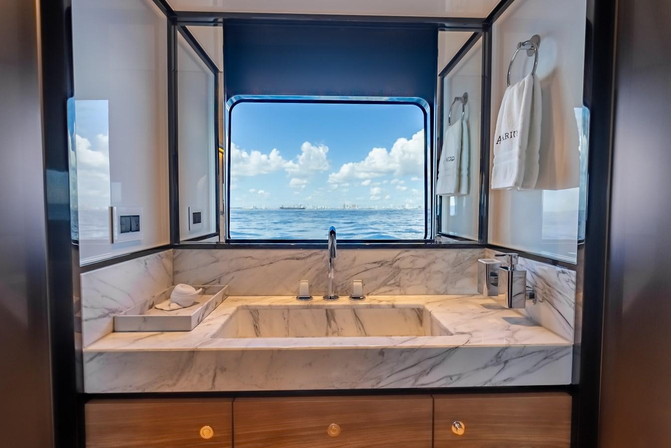 a bathroom with a large window aboard AQUARIUS Yacht for Sale