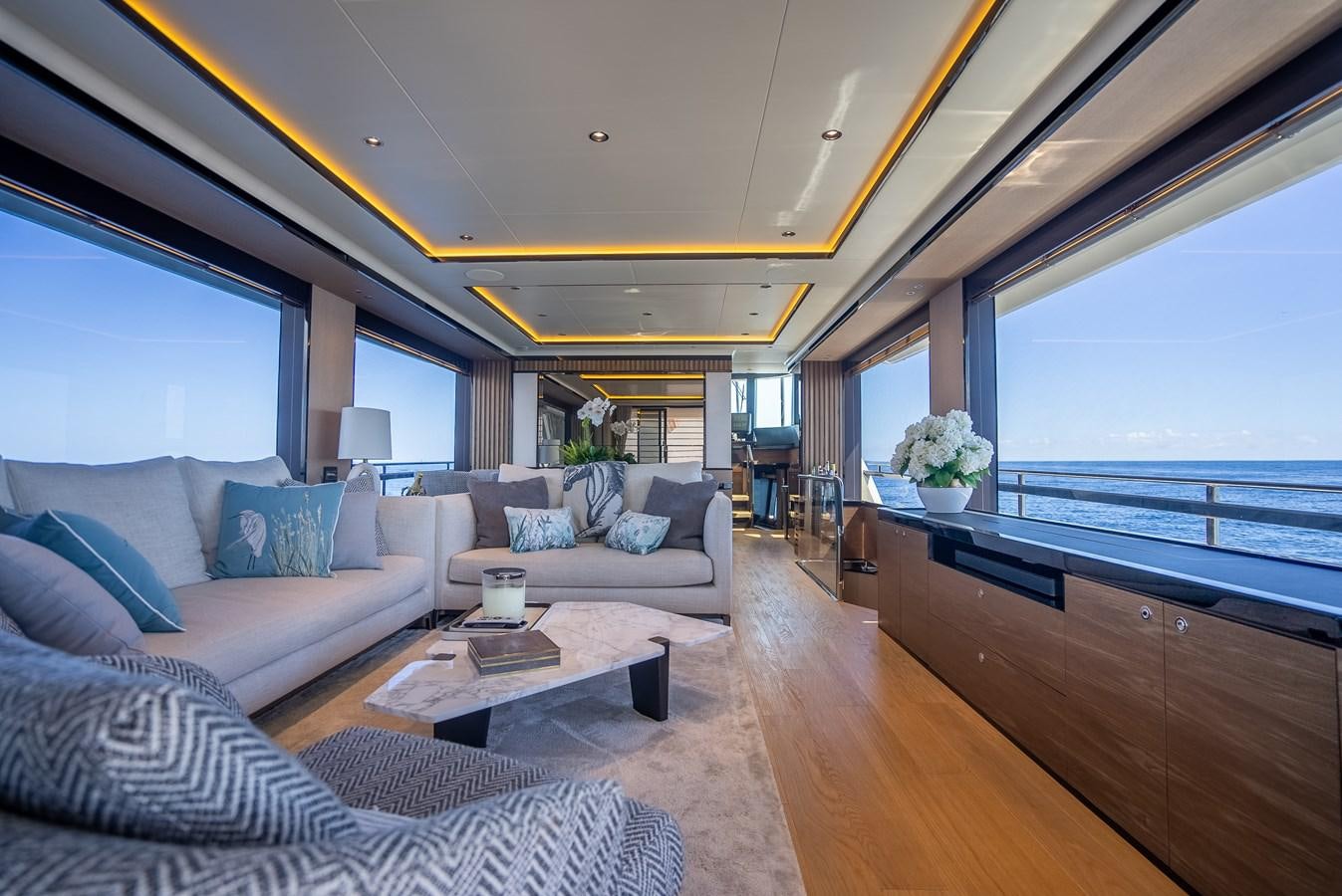 a living room with a large window aboard AQUARIUS Yacht for Sale