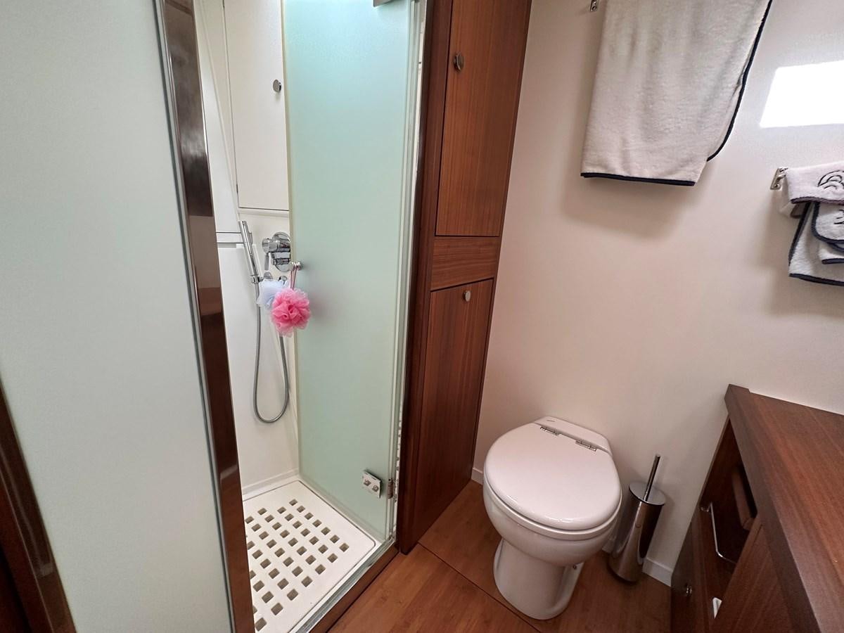 a bathroom with a toilet and a sink aboard REGINA Yacht for Sale