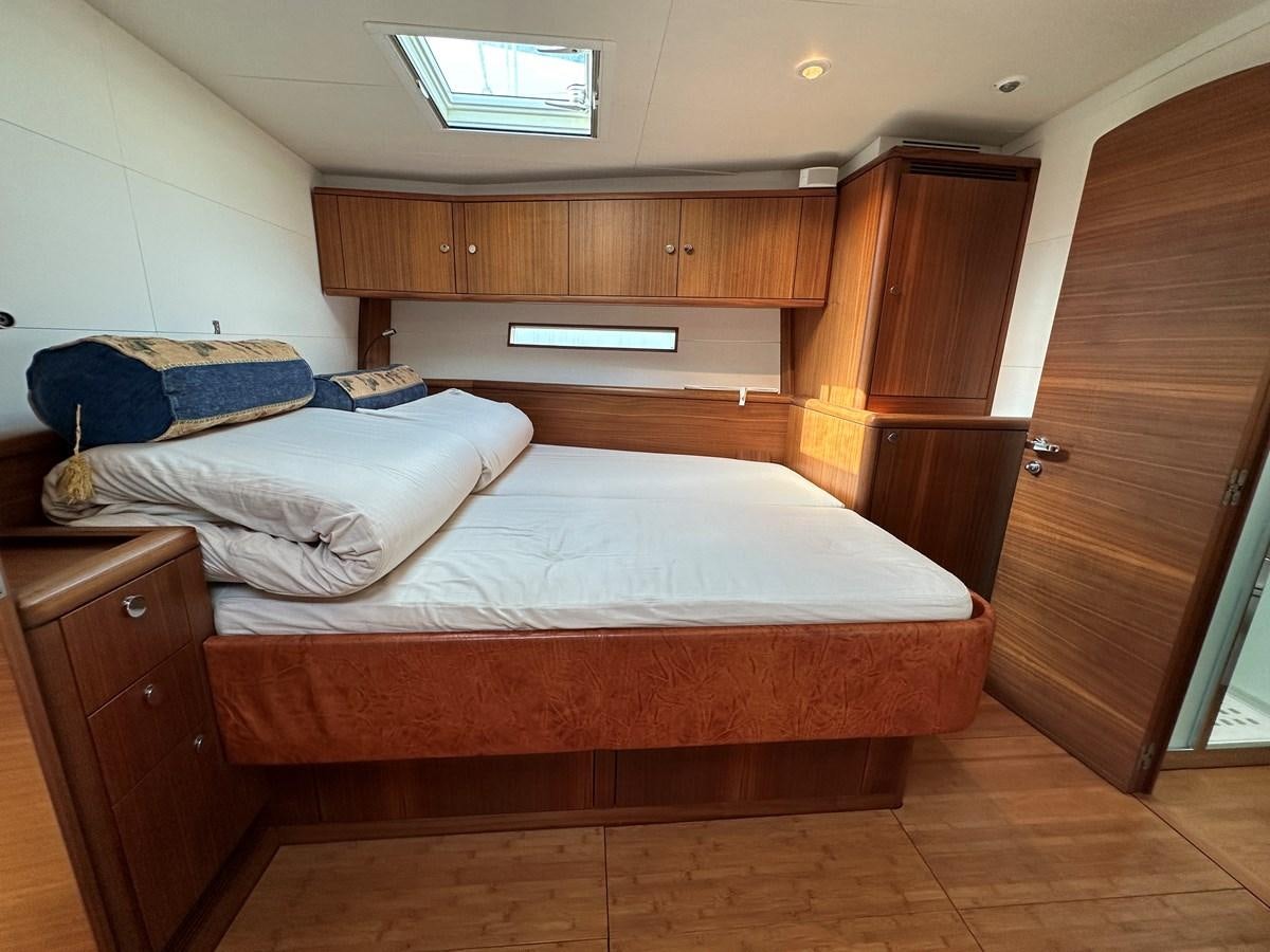 a bed in a room aboard REGINA Yacht for Sale
