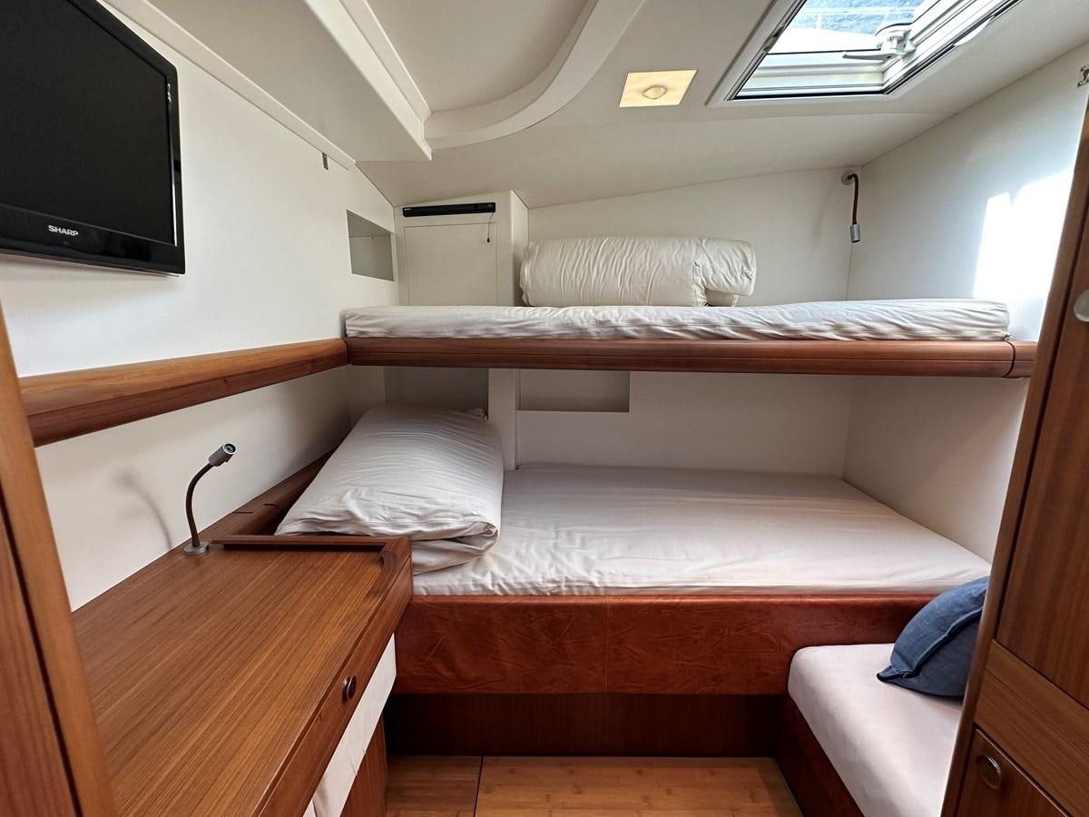 a room with bunk beds aboard REGINA Yacht for Sale