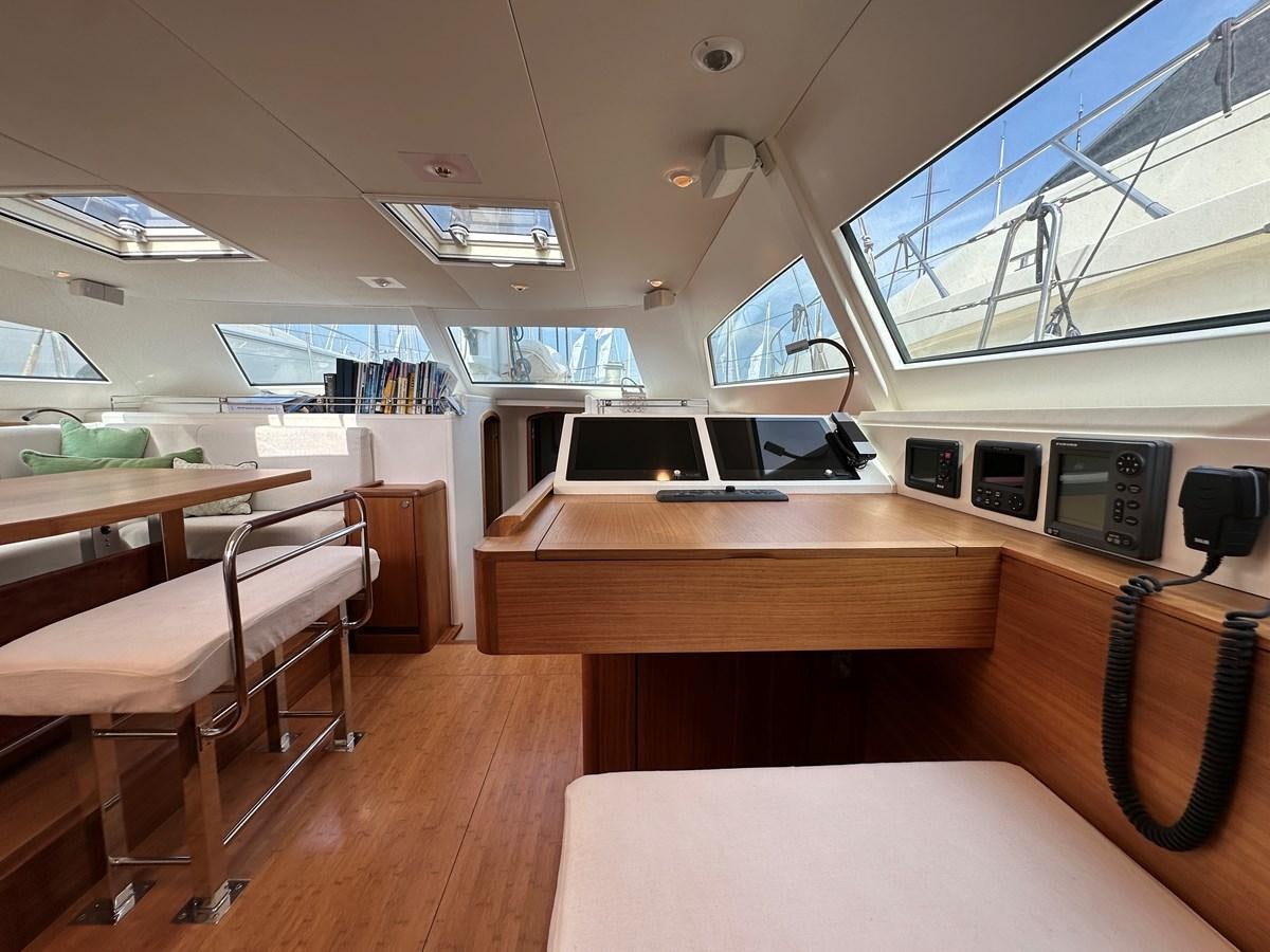 a room with a table and chairs aboard REGINA Yacht for Sale
