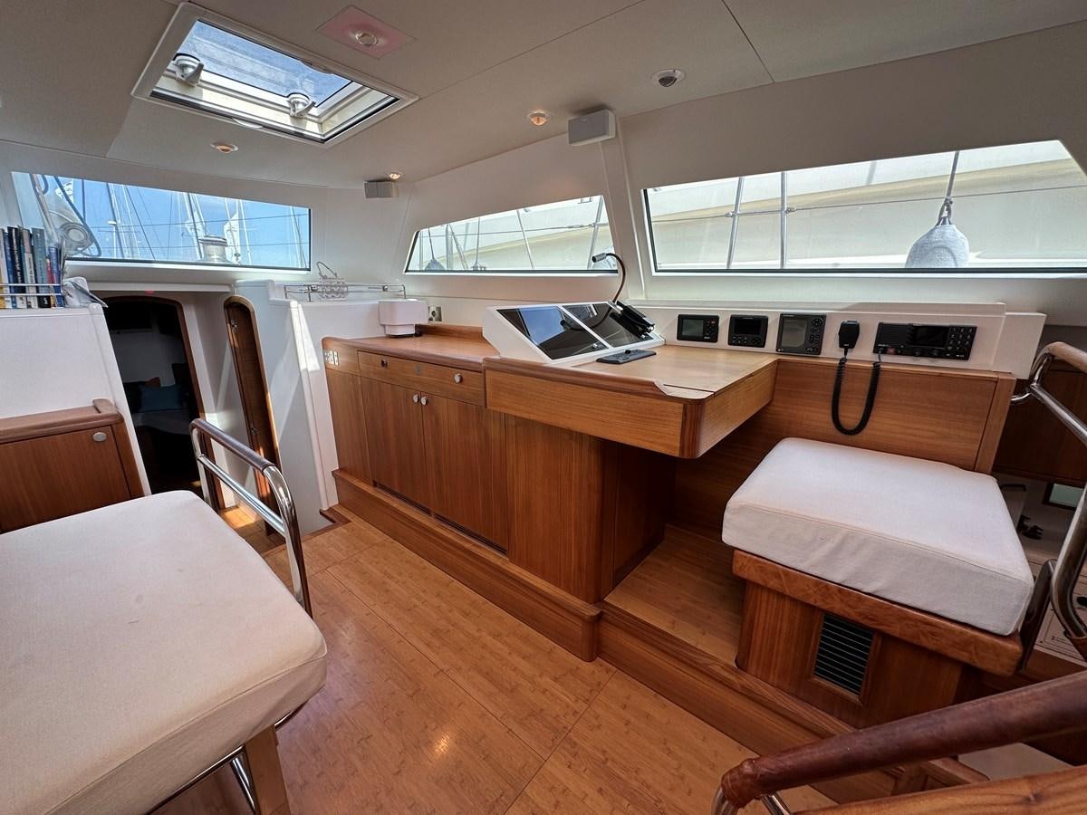 a room with a desk and a laptop on a table aboard REGINA Yacht for Sale