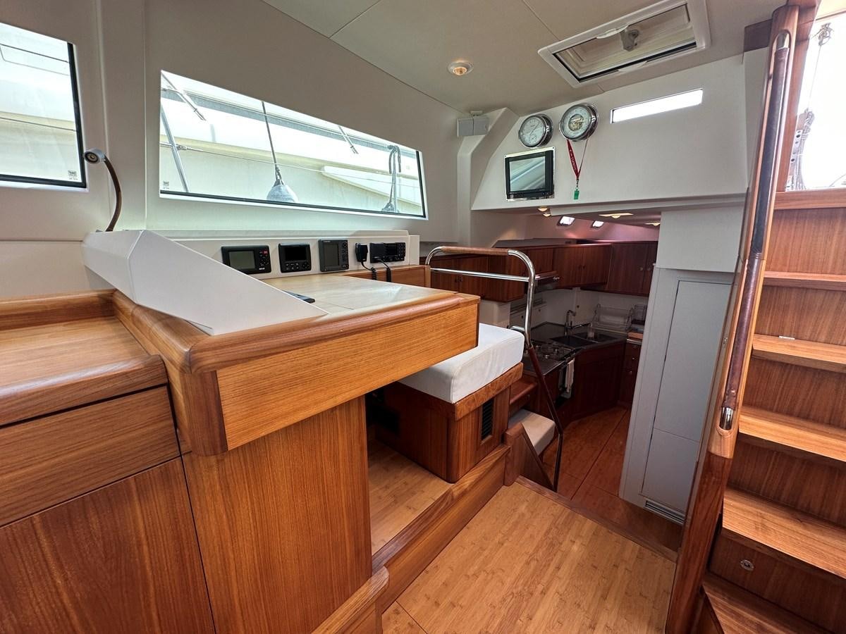 a room with desks and a window aboard REGINA Yacht for Sale