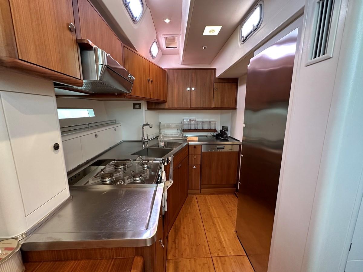 a kitchen with a stove and sink aboard REGINA Yacht for Sale