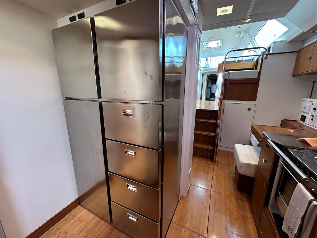 a large refrigerator in a kitchen aboard REGINA Yacht for Sale