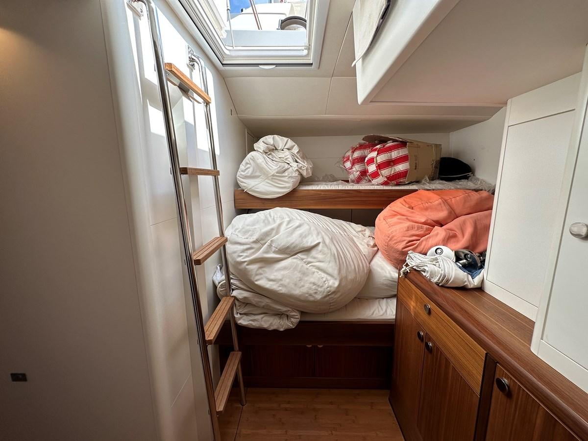 a room with a bed and a closet aboard REGINA Yacht for Sale