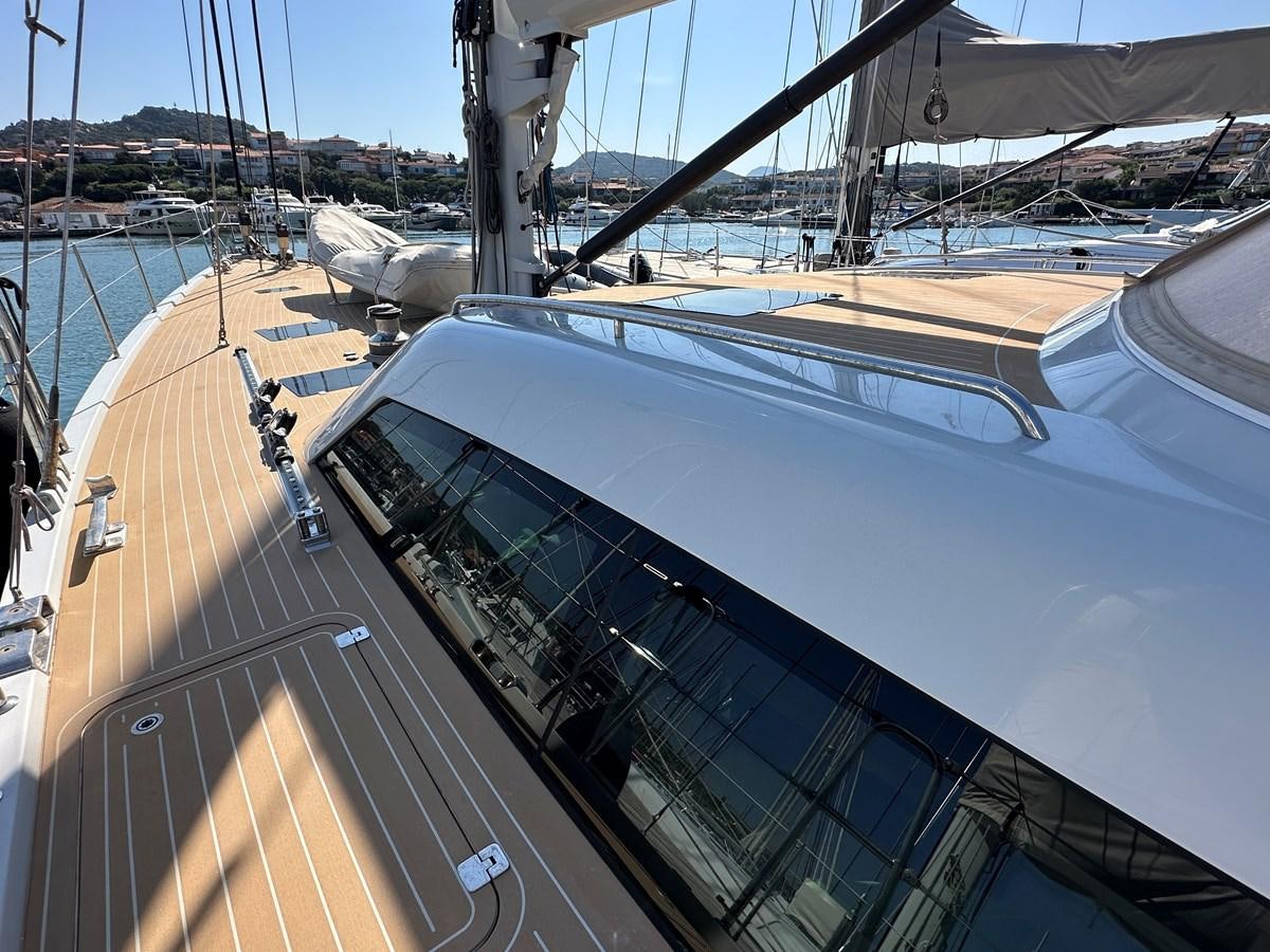 a large ship in a harbor aboard REGINA Yacht for Sale