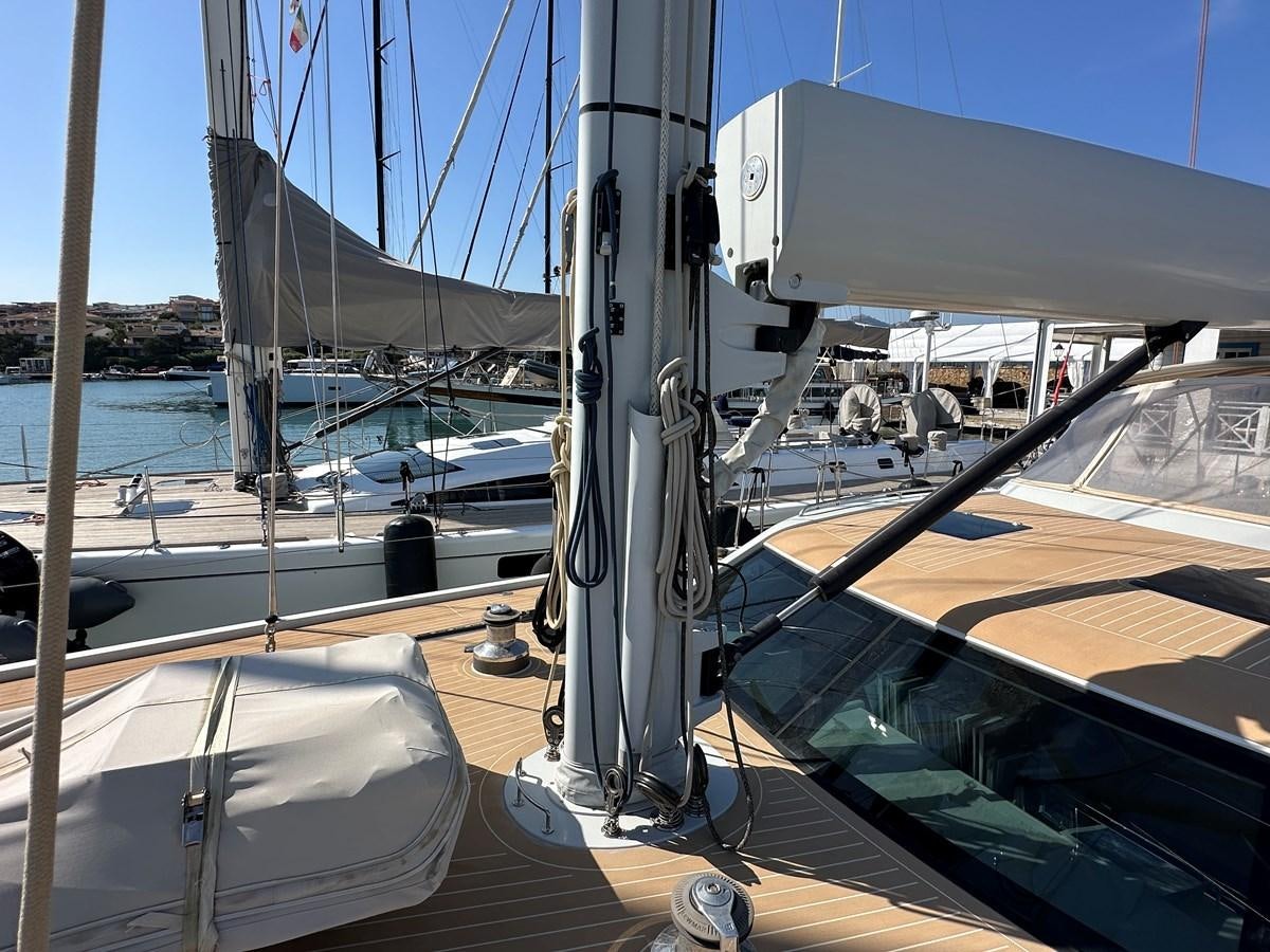 a deck with a boat and a railing and water aboard REGINA Yacht for Sale