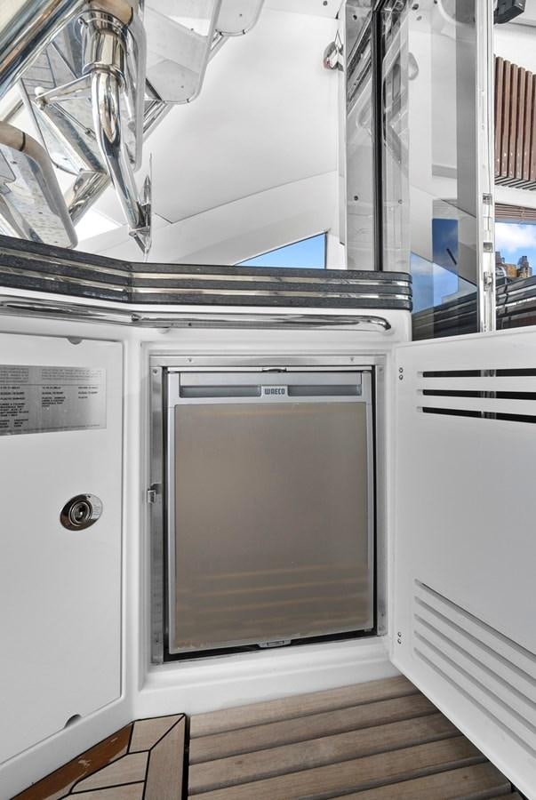 a microwave oven and a refrigerator aboard EL REY Yacht for Sale