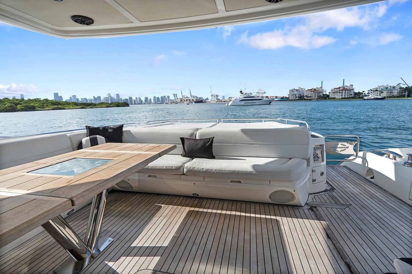 a deck with a view of a city and water aboard EL REY Yacht for Sale