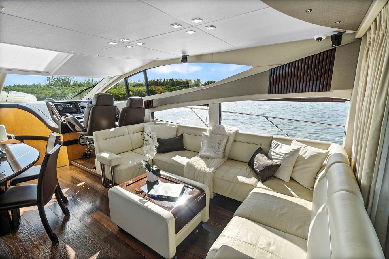 a living room with a large window aboard EL REY Yacht for Sale