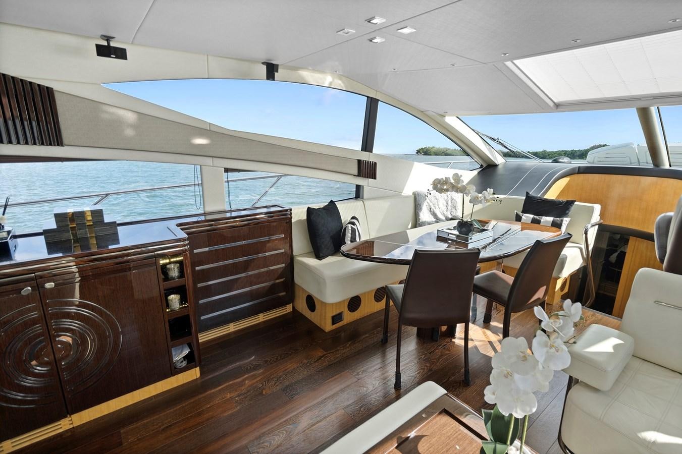 a room with a table and chairs aboard EL REY Yacht for Sale