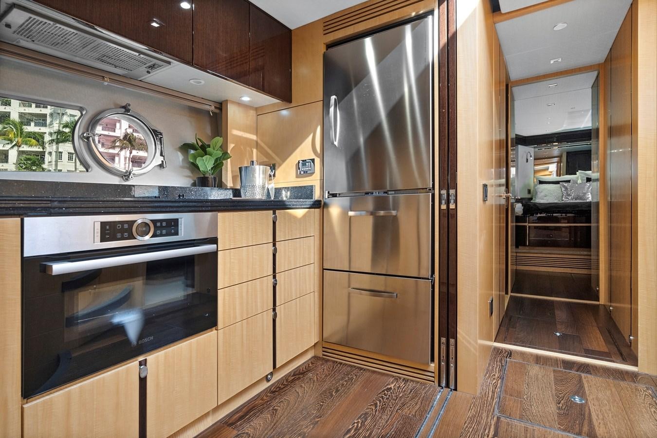 a kitchen with wooden cabinets aboard EL REY Yacht for Sale