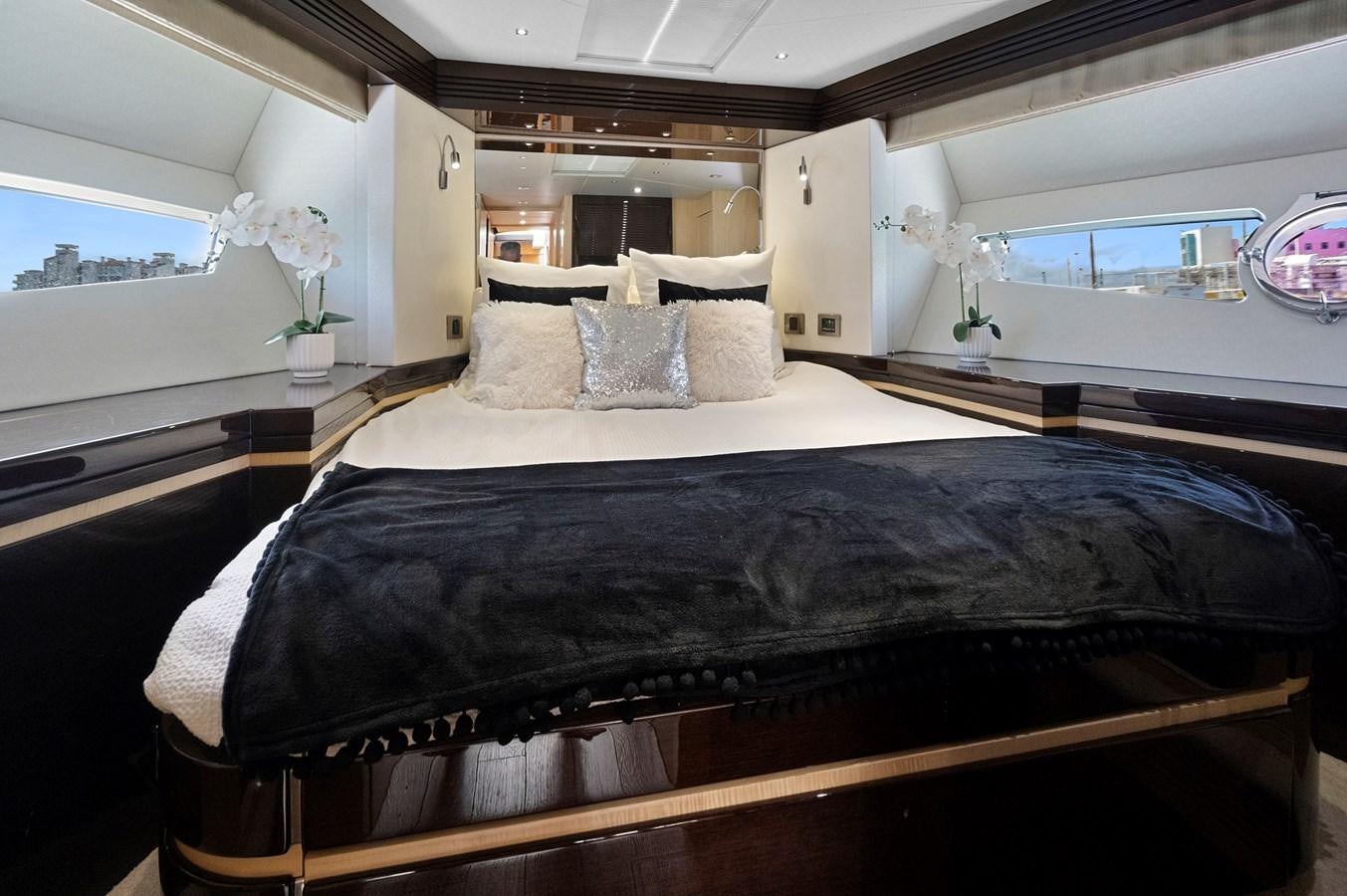 a bed in a room aboard EL REY Yacht for Sale
