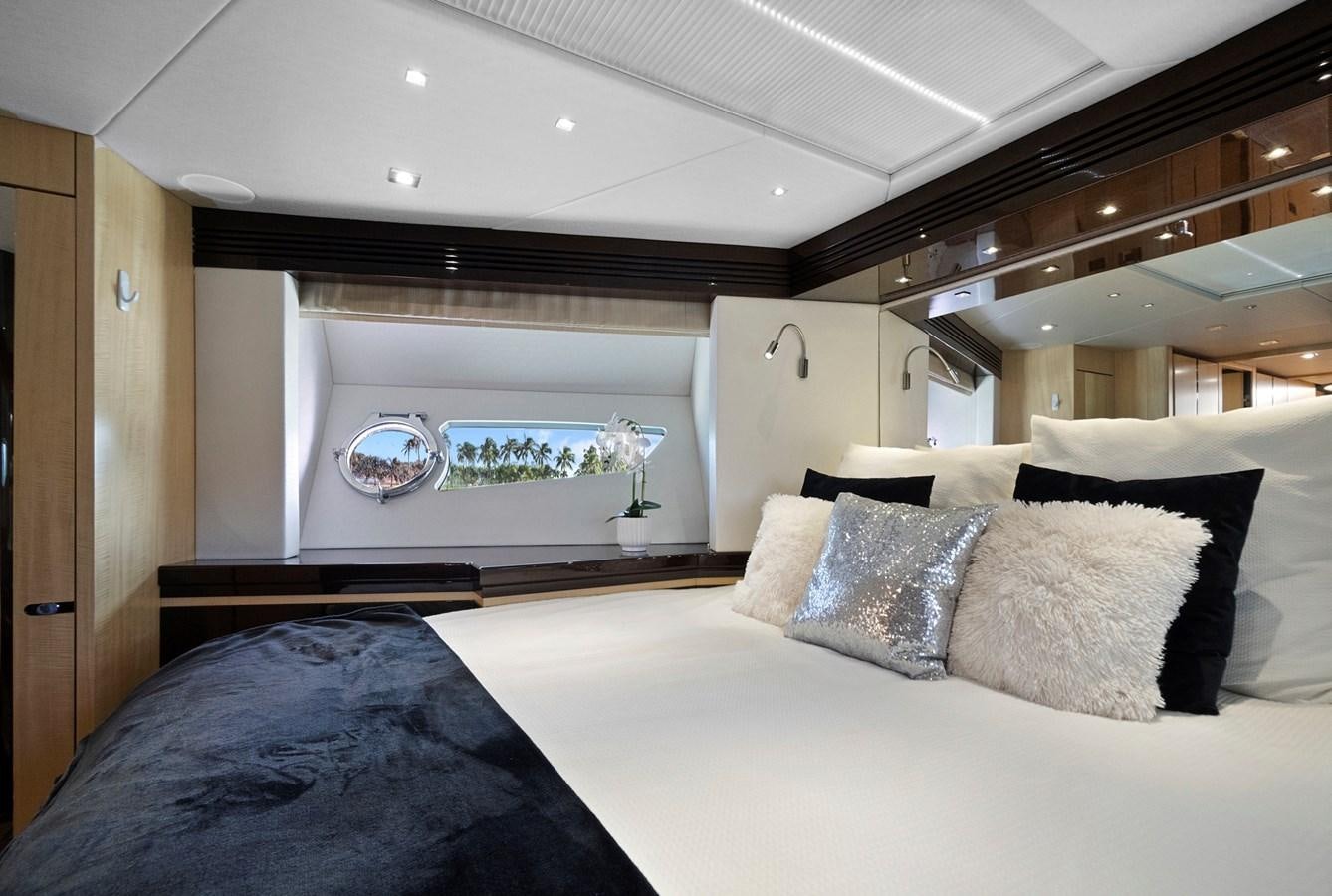 a bed with white sheets aboard EL REY Yacht for Sale