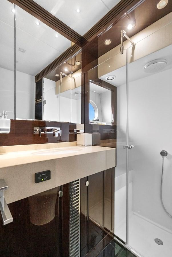 a bathroom with a large mirror aboard EL REY Yacht for Sale