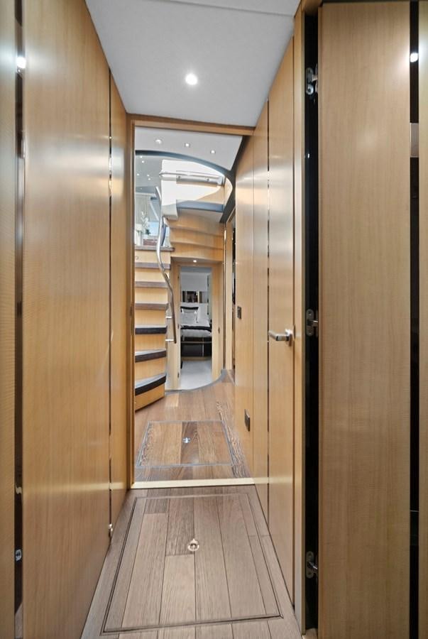 a long hallway with doors aboard EL REY Yacht for Sale