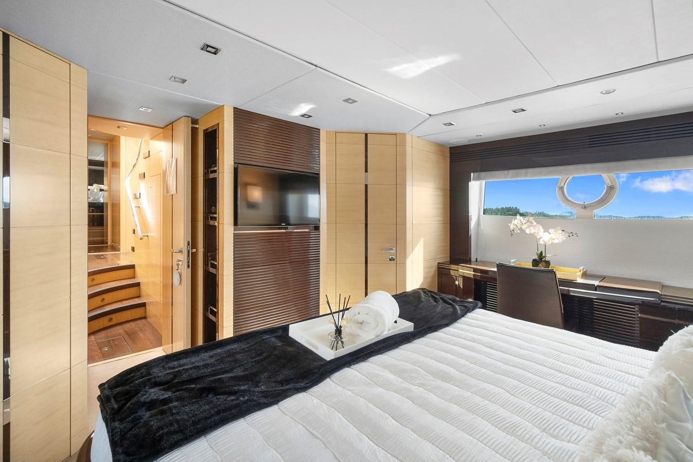 a bedroom with a bed and a closet aboard EL REY Yacht for Sale