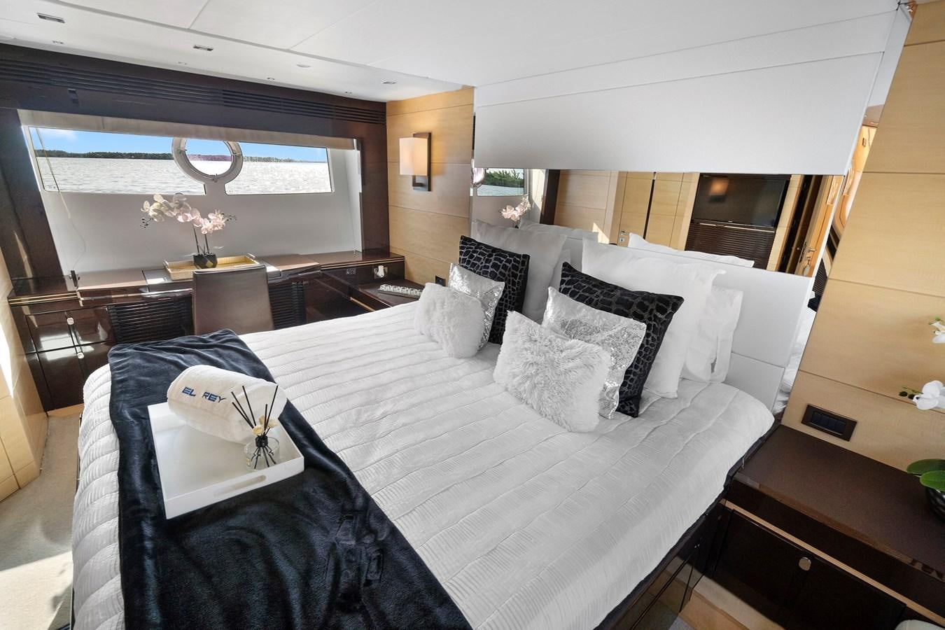 a bedroom with a large bed aboard EL REY Yacht for Sale