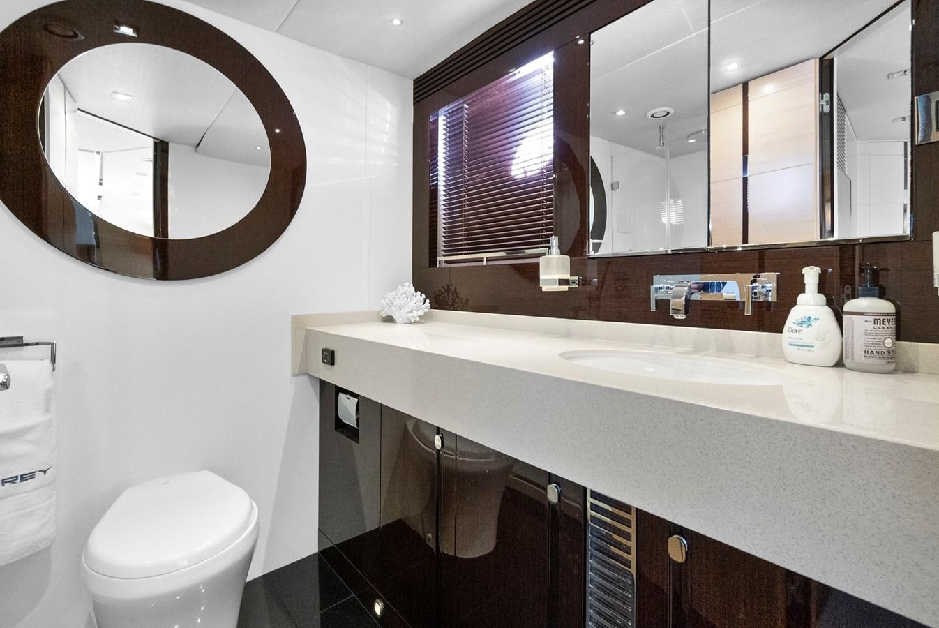 a bathroom with a large mirror aboard EL REY Yacht for Sale