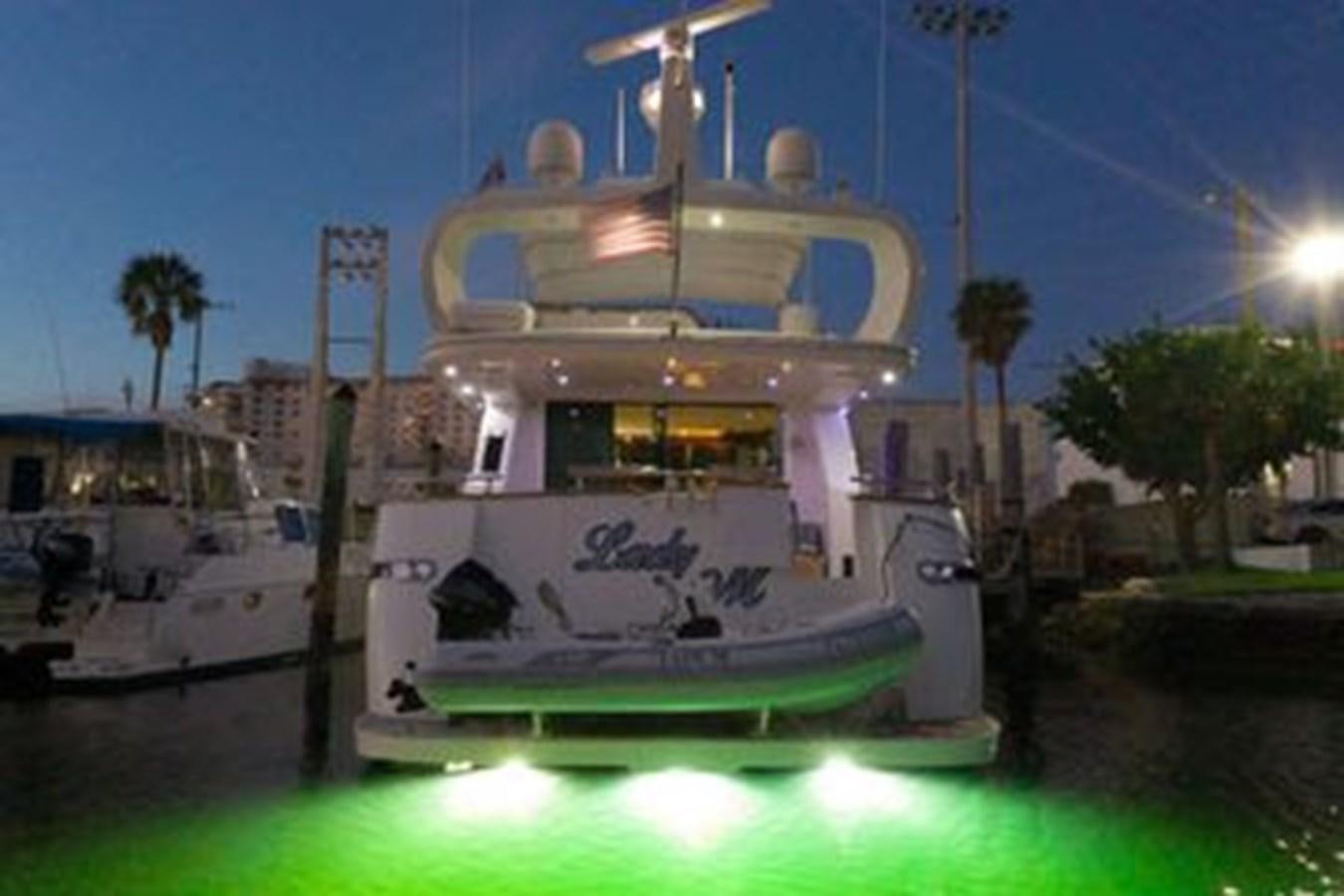 a boat in a harbor aboard 1997 MAIORA FIPA 70' FLYBRIDGE Yacht for Sale