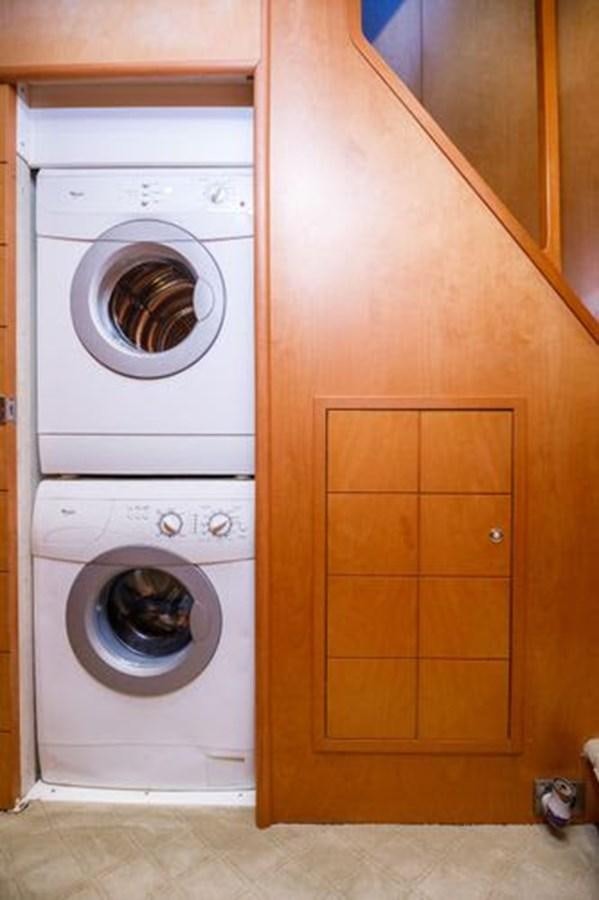 a closet with a washing machine aboard 1997 MAIORA FIPA 70' FLYBRIDGE Yacht for Sale