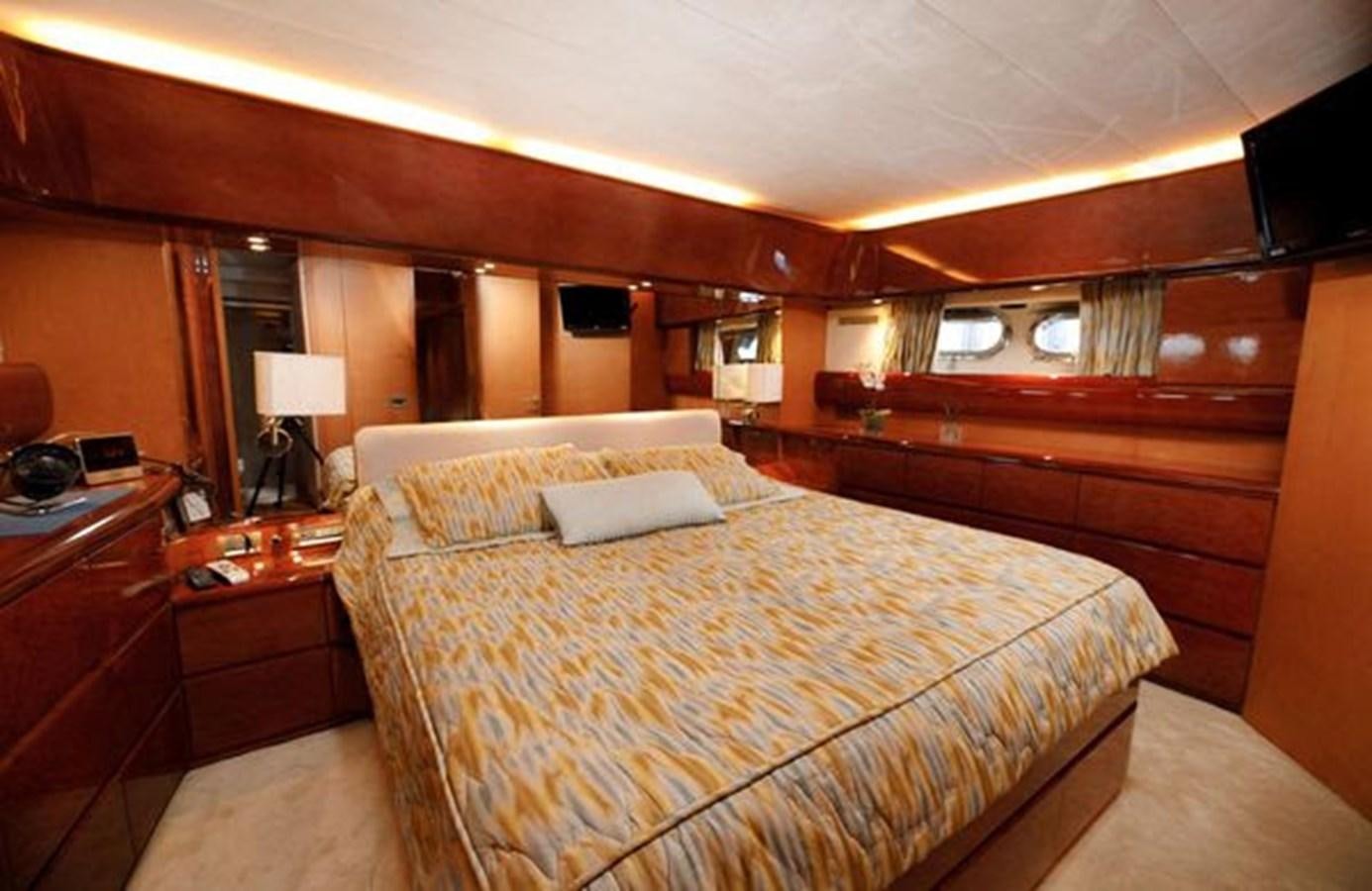 a hotel room with a bed aboard 1997 MAIORA FIPA 70' FLYBRIDGE Yacht for Sale
