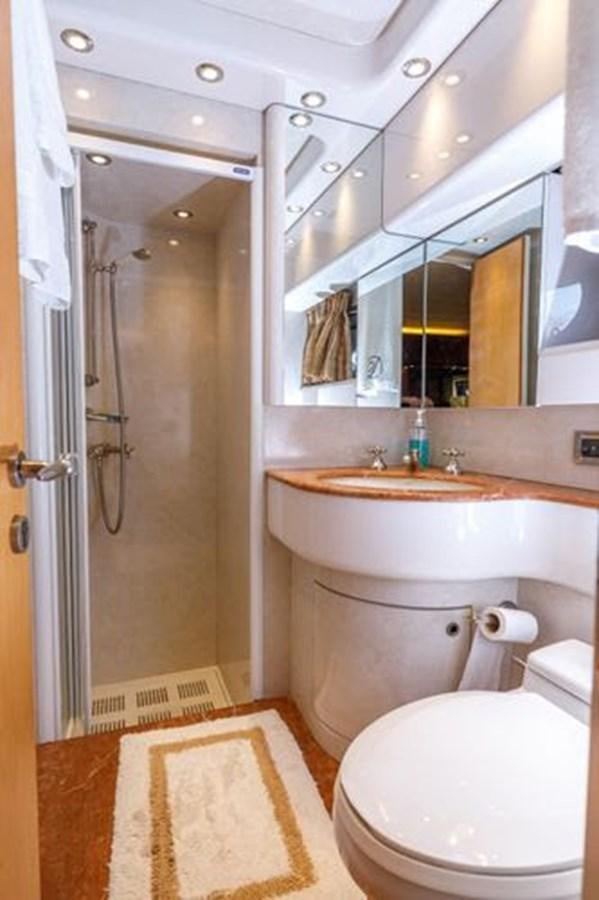 a bathroom with a sink and toilet aboard 1997 MAIORA FIPA 70' FLYBRIDGE Yacht for Sale