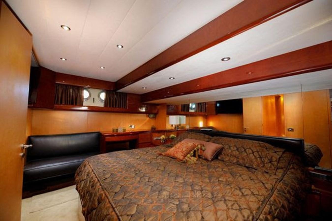 a bed in a room aboard 1997 MAIORA FIPA 70' FLYBRIDGE Yacht for Sale