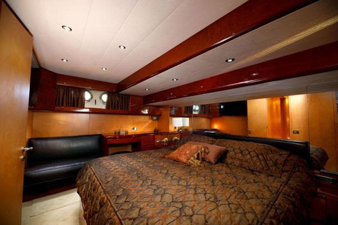 a bed in a room aboard 1997 MAIORA FIPA 70' FLYBRIDGE Yacht for Sale