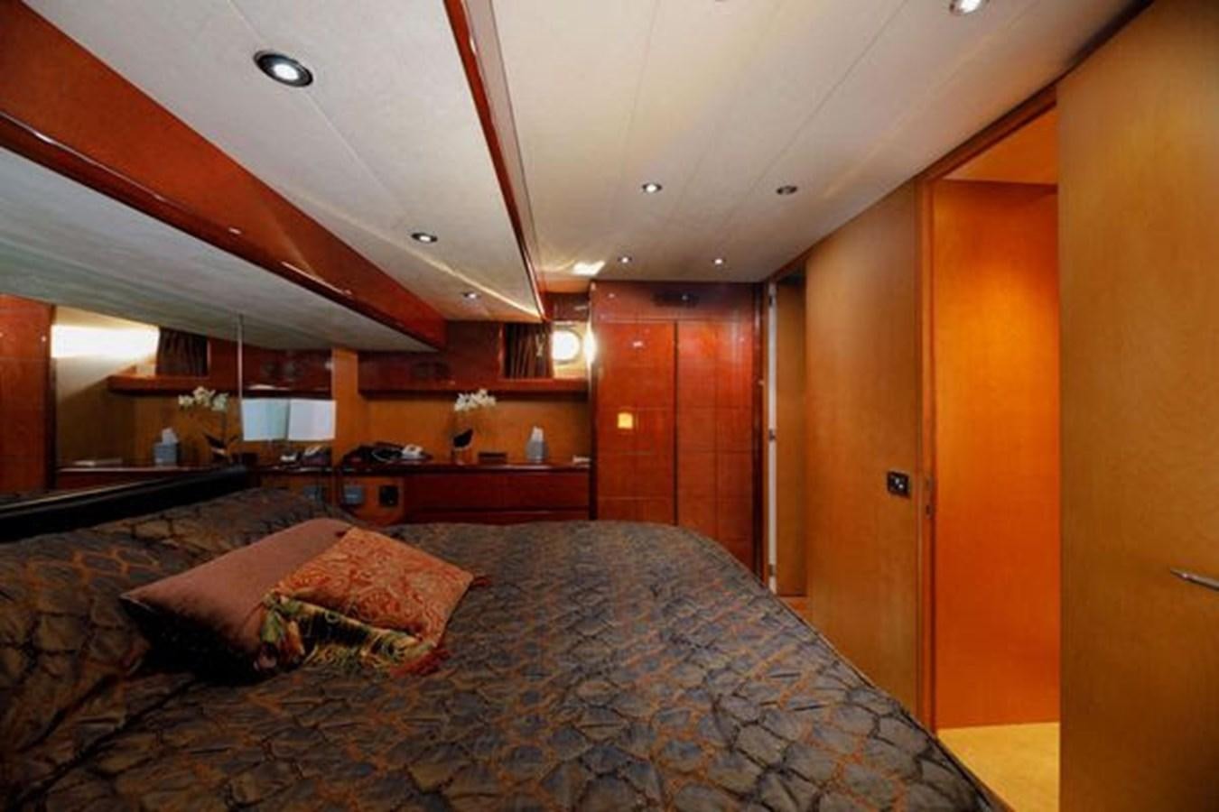 a bed in a room aboard 1997 MAIORA FIPA 70' FLYBRIDGE Yacht for Sale