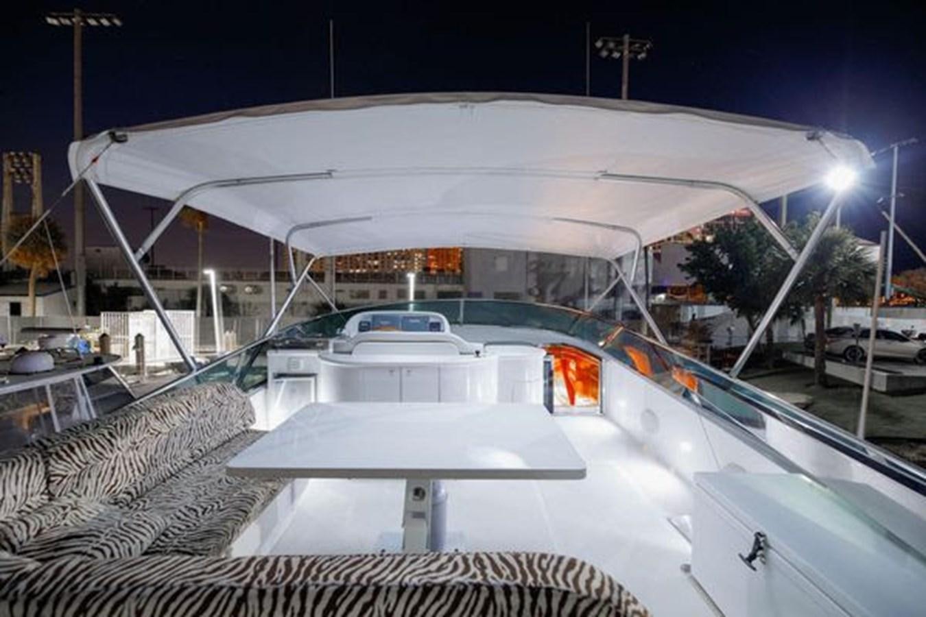 a white car with a red light aboard 1997 MAIORA FIPA 70' FLYBRIDGE Yacht for Sale