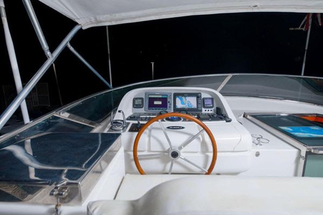 the inside of a car aboard 1997 MAIORA FIPA 70' FLYBRIDGE Yacht for Sale