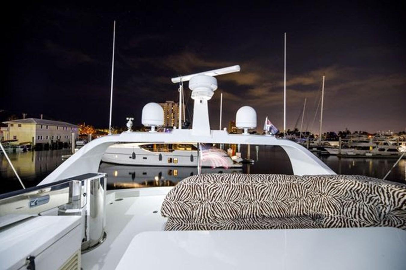 a large white ship docked aboard 1997 MAIORA FIPA 70' FLYBRIDGE Yacht for Sale