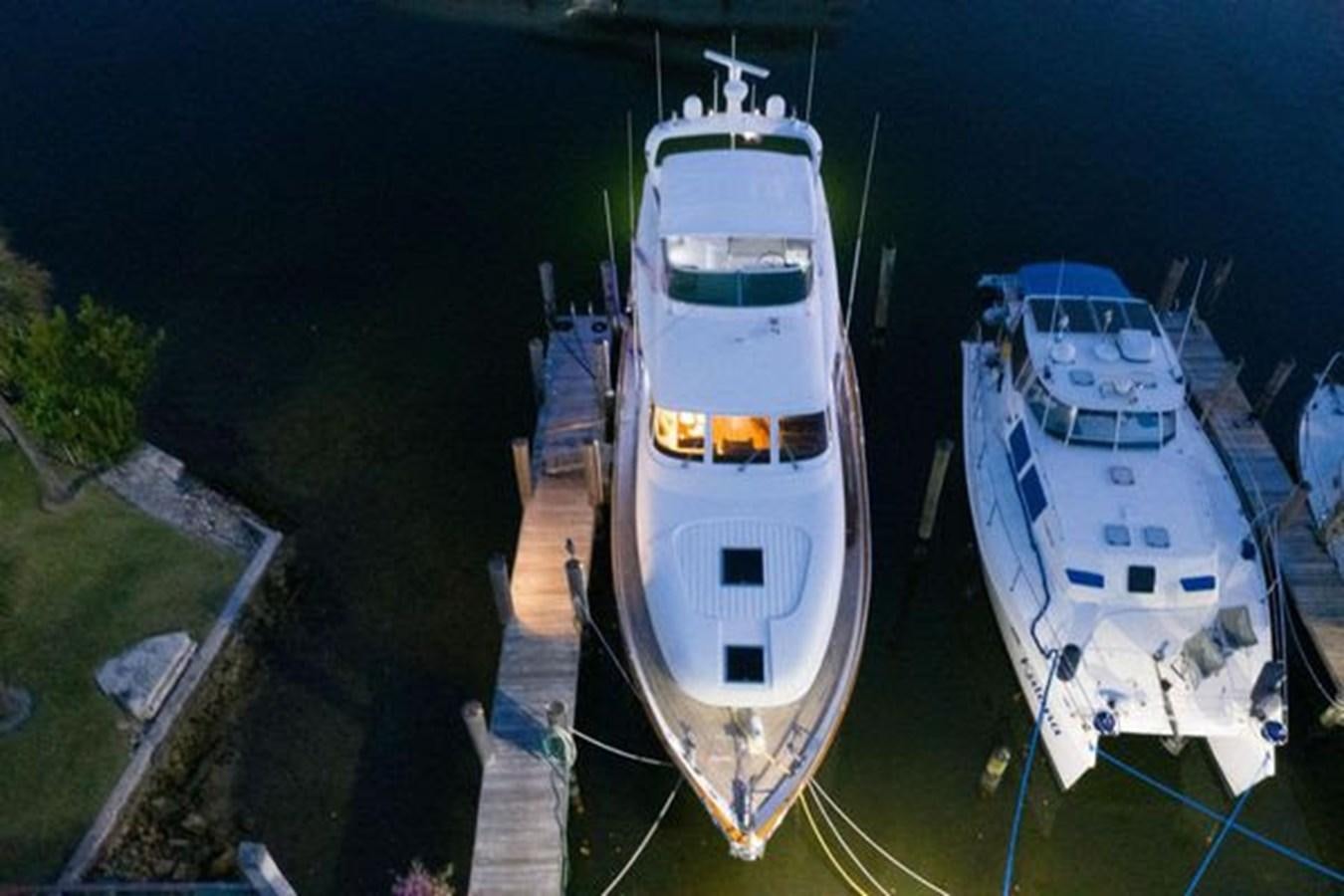 a group of boats on a river aboard 1997 MAIORA FIPA 70' FLYBRIDGE Yacht for Sale