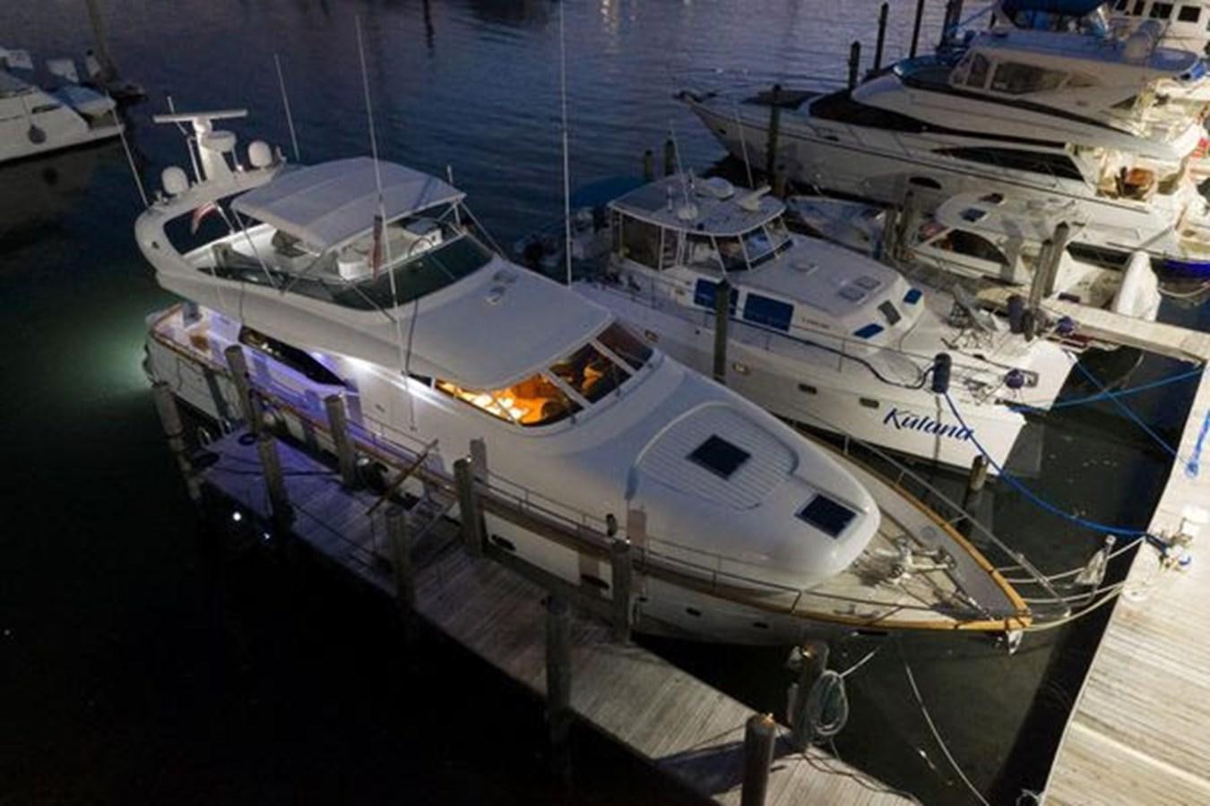a group of boats docked aboard 1997 MAIORA FIPA 70' FLYBRIDGE Yacht for Sale