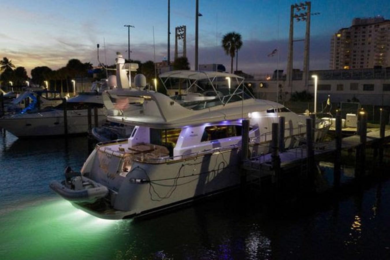 a boat docked at a pier aboard 1997 MAIORA FIPA 70' FLYBRIDGE Yacht for Sale