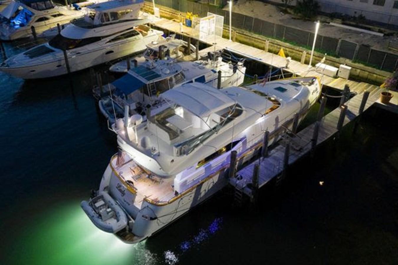 a large ship docked aboard 1997 MAIORA FIPA 70' FLYBRIDGE Yacht for Sale