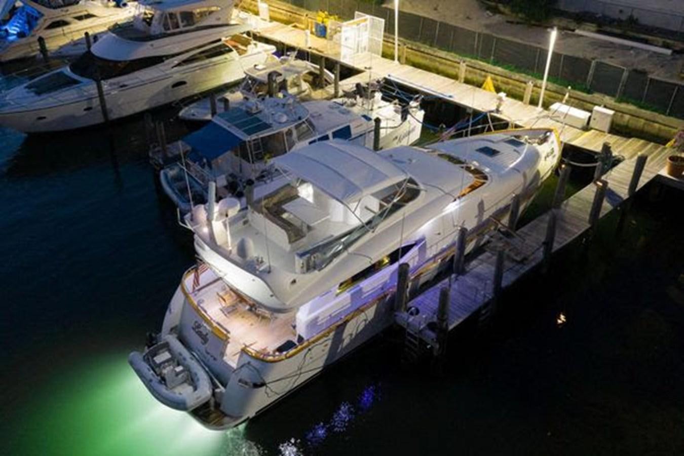 a large ship docked aboard 1997 MAIORA FIPA 70' FLYBRIDGE Yacht for Sale