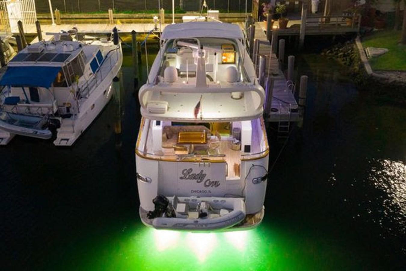 a boat is parked in the water aboard 1997 MAIORA FIPA 70' FLYBRIDGE Yacht for Sale