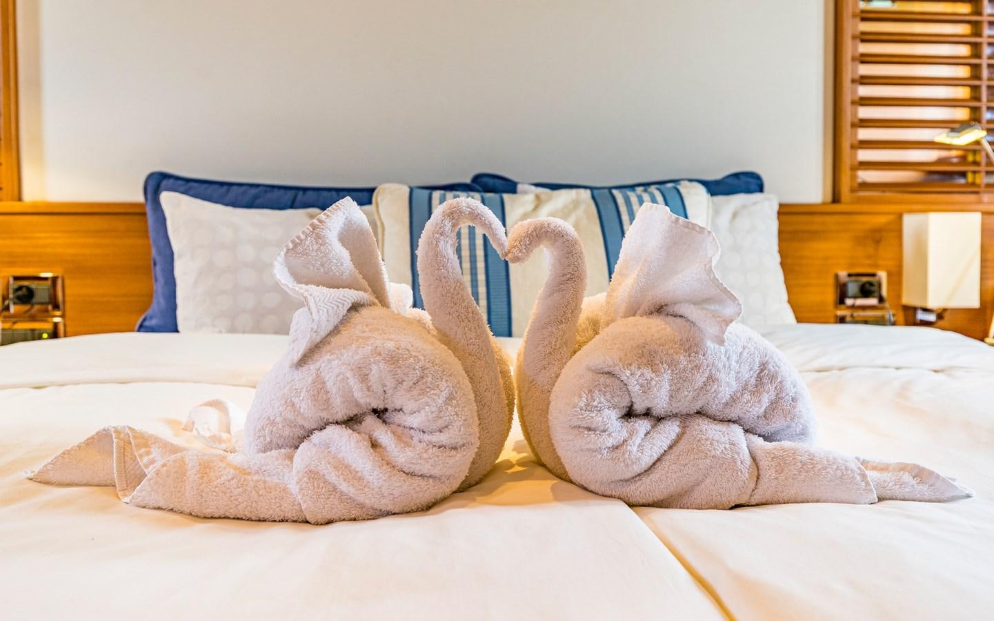 a group of stuffed animals on a bed aboard PARODIA Yacht for Sale