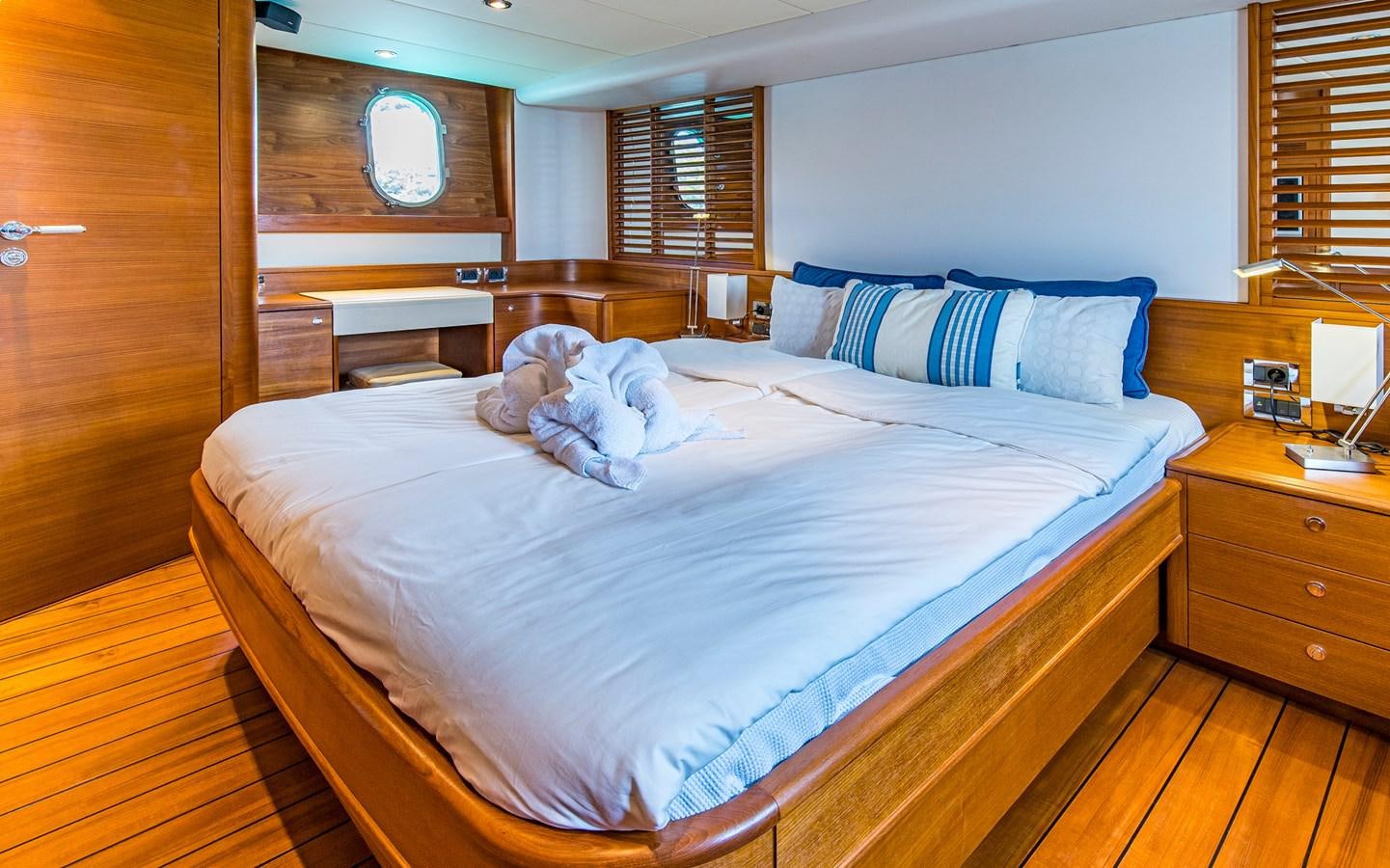 a couple of cats on a bed aboard PARODIA Yacht for Sale