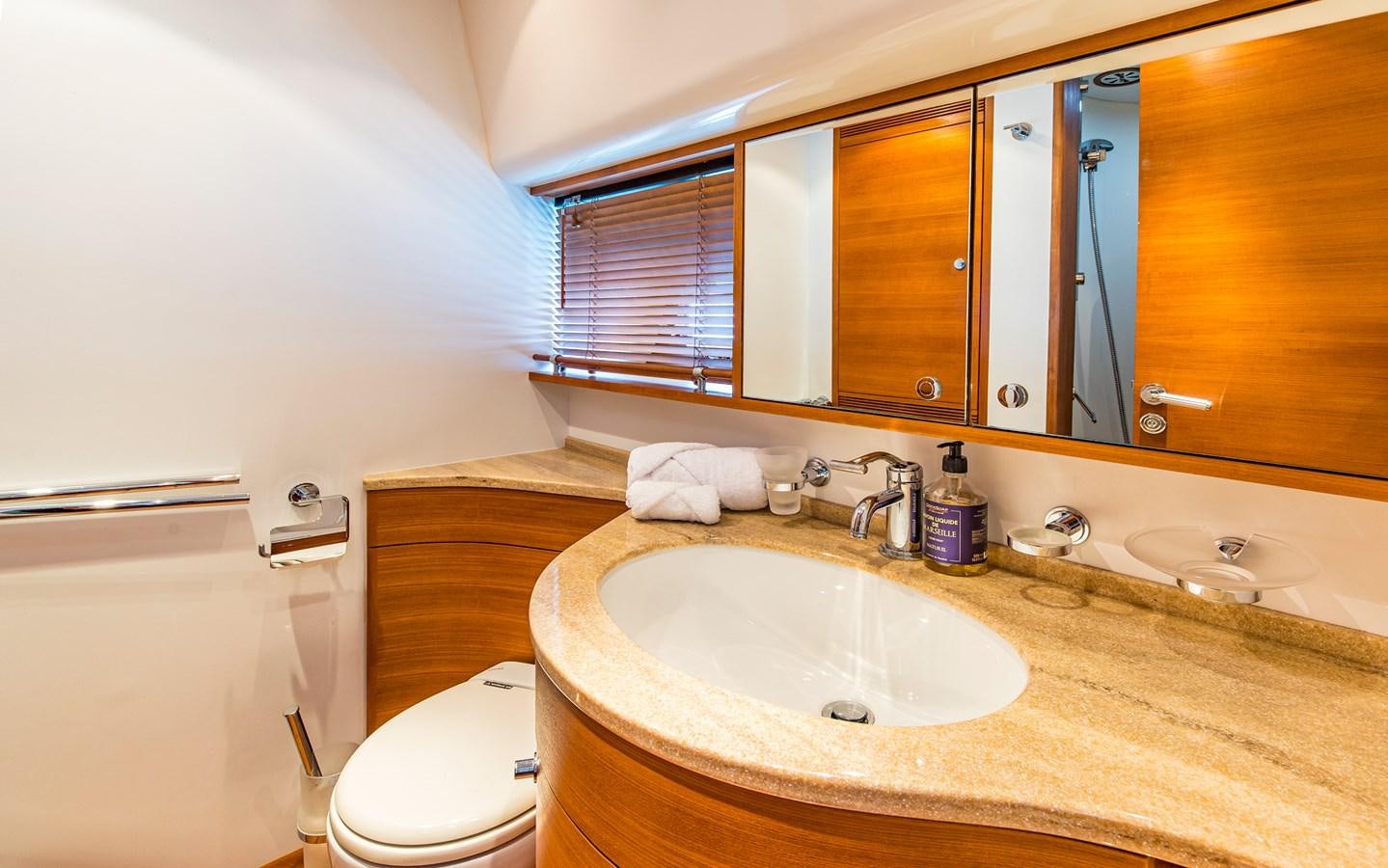 a bathroom with a sink and a toilet aboard PARODIA Yacht for Sale