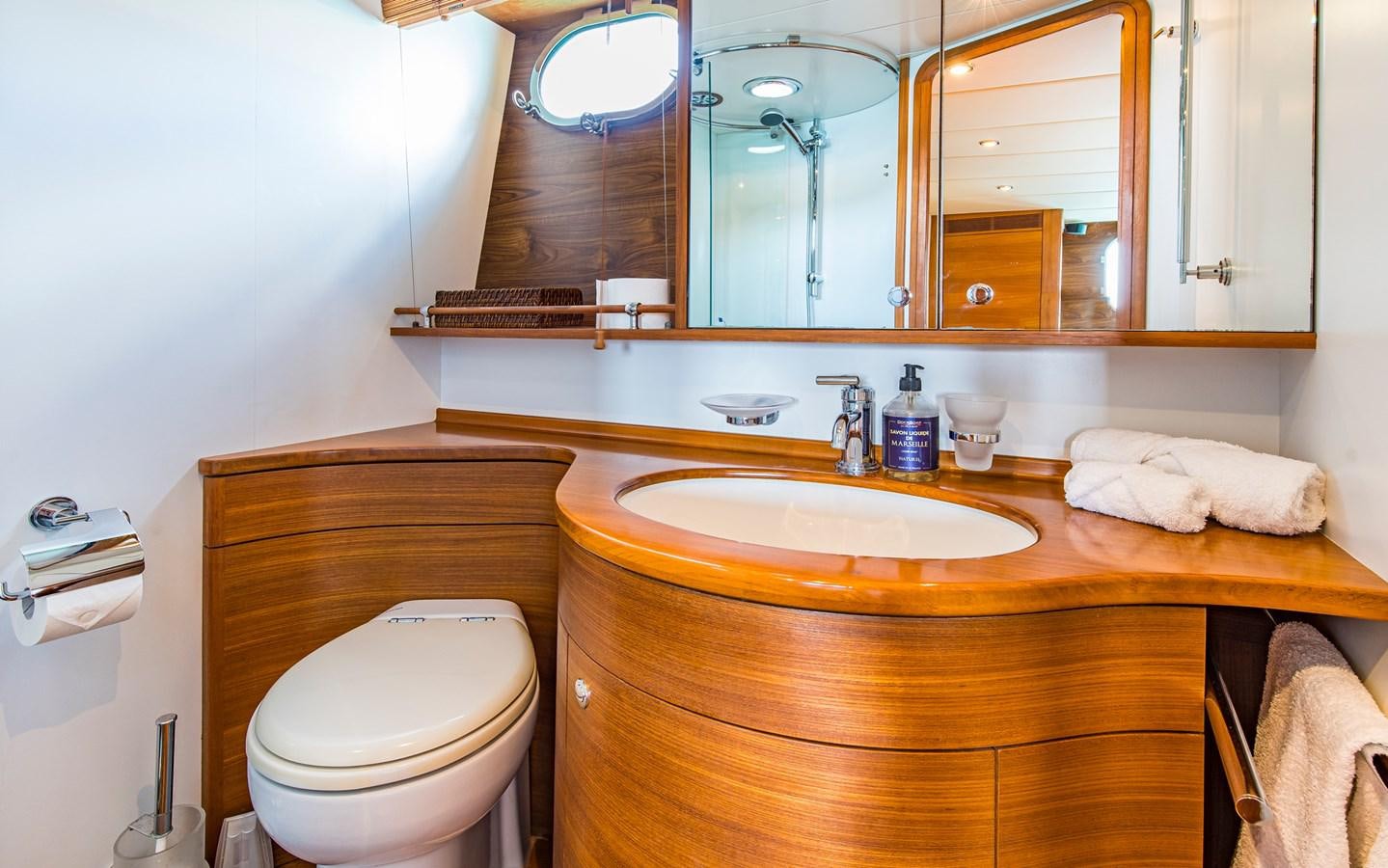 a bathroom with a sink and toilet aboard PARODIA Yacht for Sale