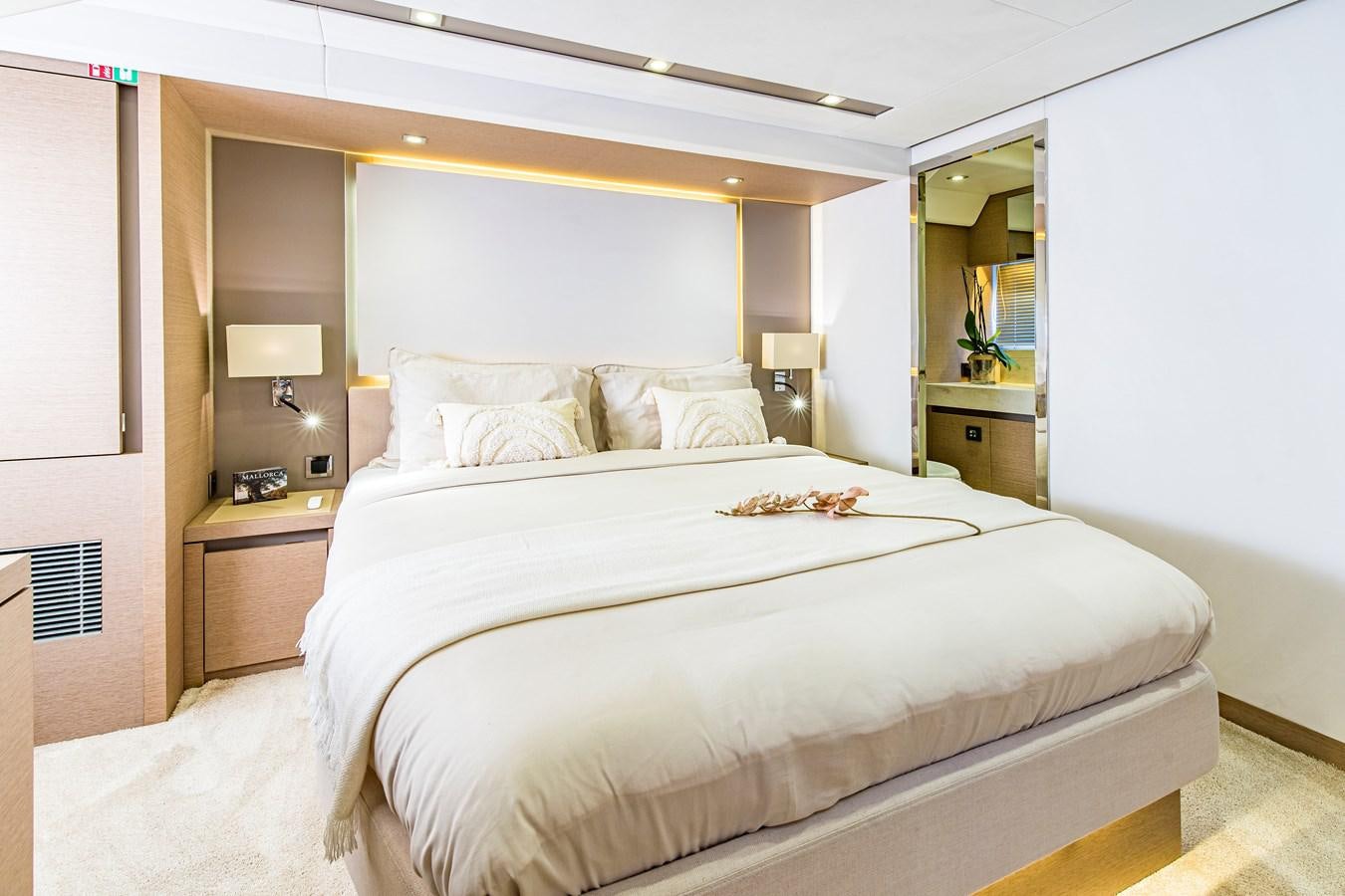 a bed with white sheets aboard BLUE M Yacht for Sale